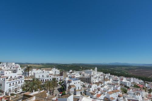 an aerial view of a city with white buildings at La Botica de Vejer in Vejer de la Frontera