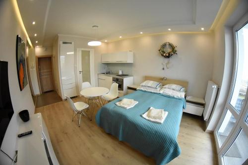 Posteľ alebo postele v izbe v ubytovaní Apartament No.1