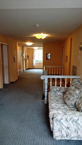 a room with a bed and a table in it at Kloesterle in Bad Steben