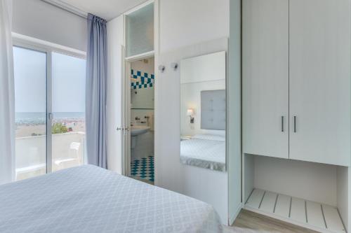Postel nebo postele na pokoji v ubytování Hotel Garni' Serena