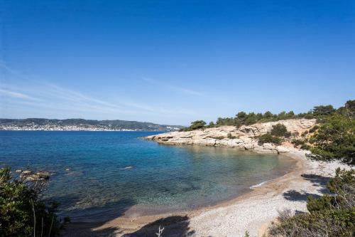 a view of a beach with rocks and water at Porto Heli Villa in Porto Heli