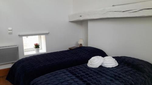 Postel nebo postele na pokoji v ubytování La Cuvée-Saint-Georges