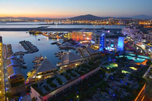 an aerial view of a city at night at Luxury Yacht Hotel in Gibraltar