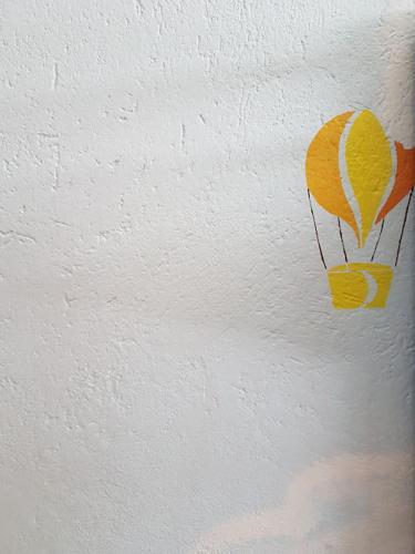 a painting of a parachute on a wall at Casa chanoux in Chambave