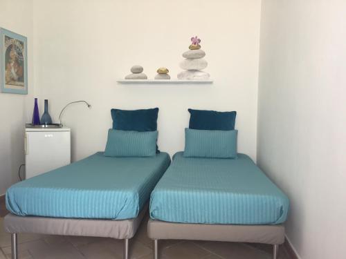 Ліжко або ліжка в номері Monolocale "Villari"
