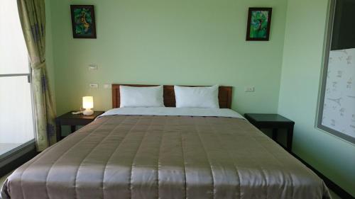 Cama o camas de una habitación en Kuan Min B&B