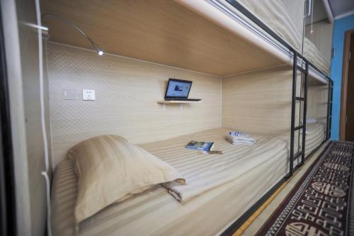 a bunk bed with a laptop on top of it at Mongolian Vision Tours in Ulaanbaatar