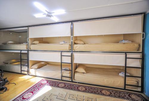 a room with a bunch of bunk beds at Mongolian Vision Tours in Ulaanbaatar