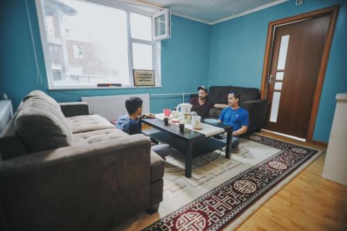 a group of people sitting in a living room at Mongolian Vision Tours in Ulaanbaatar