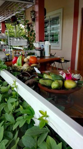 a kitchen with a bunch of fruits and vegetables at Lampang Lanna Home in Lampang