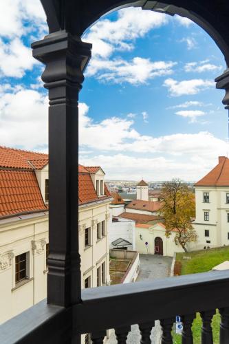 a view of the city from a balcony of a building at Bishop Apartments in Brno