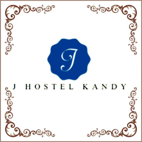 un logo con la lettera S e un cerchio blu di J hostel kandy a Kandy