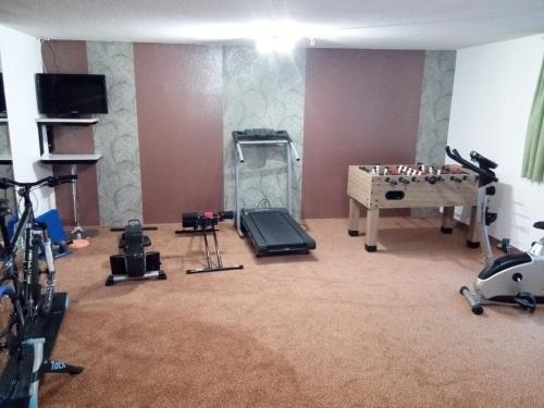 a room with a gym with a table and a chessboard at Haus Sonnseite in Au im Bregenzerwald