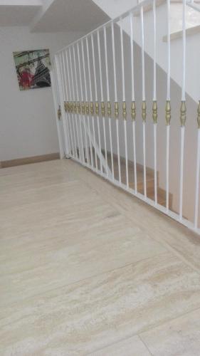 an empty room with a staircase with wooden floors at B&B D'Amare in San Salvo