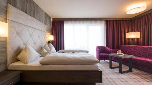 Postel nebo postele na pokoji v ubytování Kohlerhof - 4 Star Wellness & Active Hotel