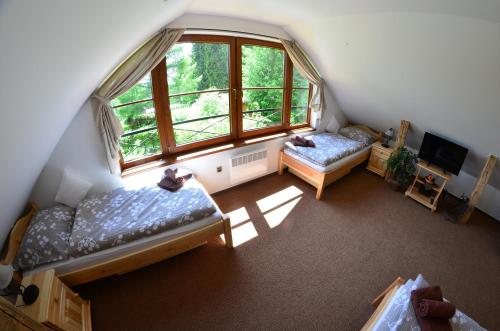 Posteľ alebo postele v izbe v ubytovaní Chata Nela