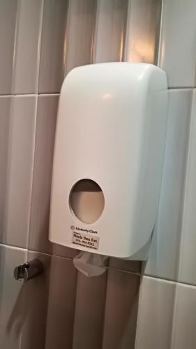 a toilet paper dispenser on the wall of a bathroom at Pangkor Home Sea Village in Pangkor