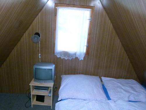 Postel nebo postele na pokoji v ubytování chata Amálka
