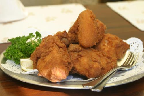 a plate of food with chicken and broccoli on a table at Landhotel Neugebauer in Löllinggraben