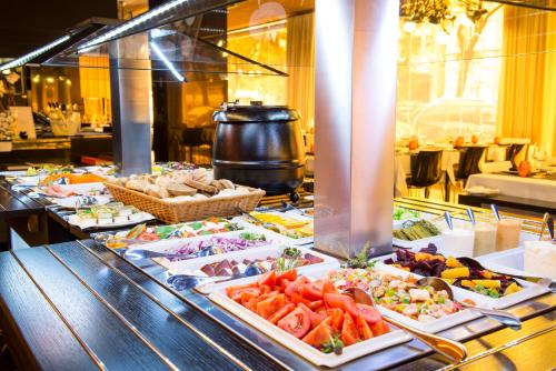 a buffet line with many different types of food at VIP Grand Lisboa Hotel & Spa in Lisbon