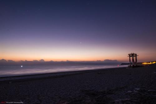 a view of the beach at night at Travel Mind in Hualien City