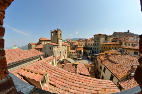an aerial view of a city with roofs at Hotel San Michele in Cortona