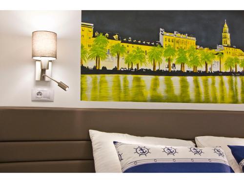 a painting of a hotel with palm trees at IDRO Studio Apartments directly at the beach in Split