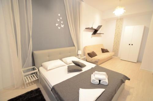 Ένα ή περισσότερα κρεβάτια σε δωμάτιο στο Uptown Residence Apartments