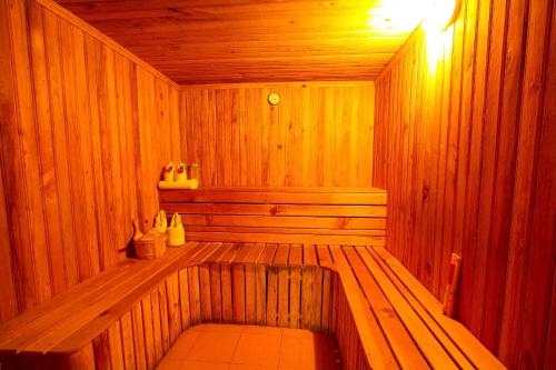 a wooden sauna with a bench in the middle at Temple Tree Resort & Spa, Pokhara in Pokhara