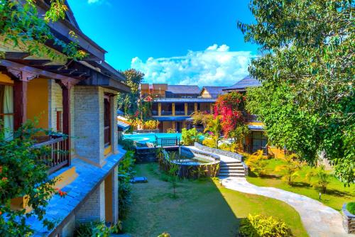 an aerial view of a house with a yard at Temple Tree Resort & Spa, Pokhara in Pokhara