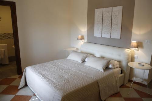 Simonetta's Roomsにあるベッド