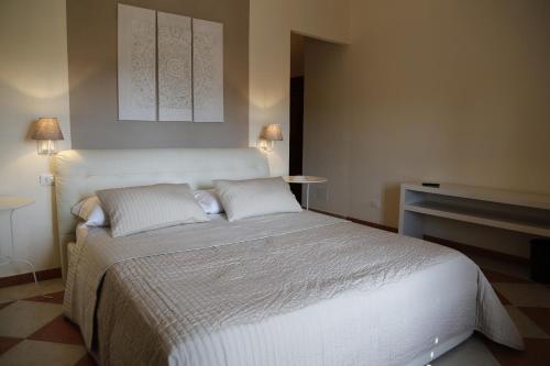 Simonetta's Roomsにあるベッド
