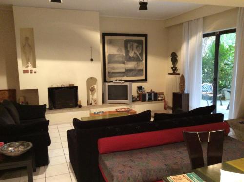 Posezení v ubytování Filyra Homestay (Όμορφο δωμάτιο σε σπίτι)