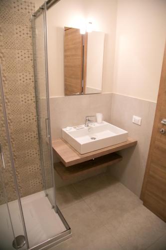 a bathroom with a sink and a shower at B&B Il Volo in Giardini Naxos