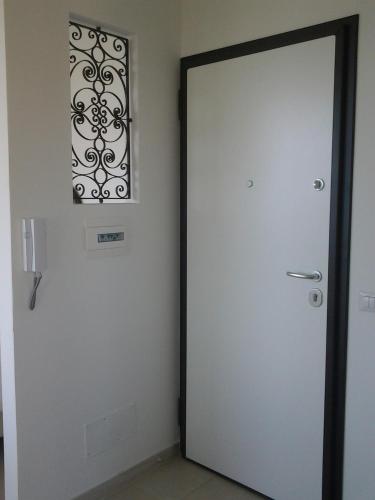 a door in a room with a picture on the wall at Sciala' in Taormina
