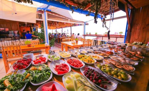 a buffet line with plates of food on a table at Ates Pension in Kaş