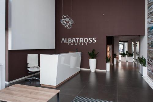 a lobby of a hair salon with a sign on the wall at Albatross Towers Joda Bed in Gdańsk