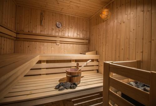 a wooden sauna with a wooden bucket in it at Spiros in Naxos Chora