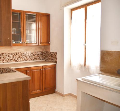 Kuchyň nebo kuchyňský kout v ubytování B&B in Centro