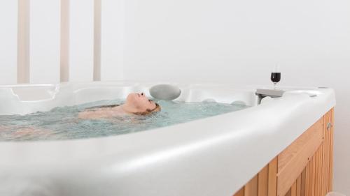 a man in a bathtub with a ball in his head at Spiros in Naxos Chora