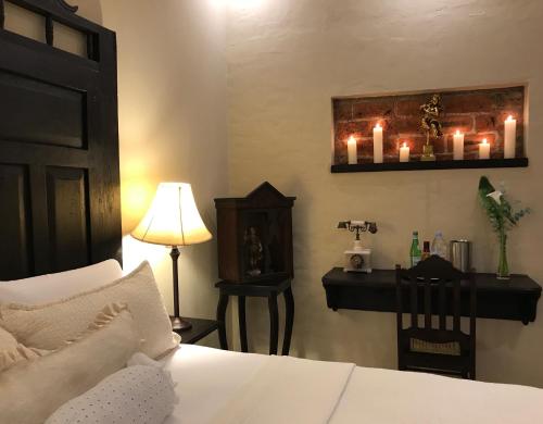 Ein Bett oder Betten in einem Zimmer der Unterkunft Casa Degraciela - Hotel Boutique