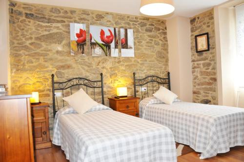 Кровать или кровати в номере Casa Vilar de Friol