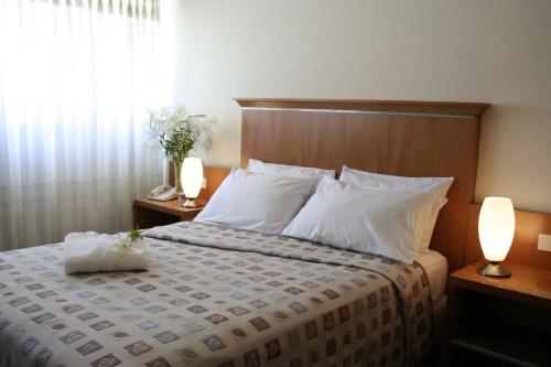 Ariston Hotelにあるベッド