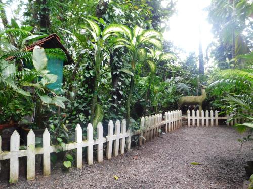 a white picket fence in front of a garden at Green Woods Bethlehem in Cochin