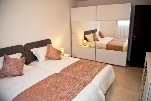 Postel nebo postele na pokoji v ubytování Deluxe Apartment Nika