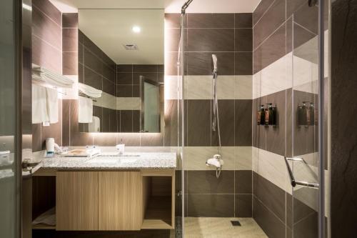 Ett badrum på Midu Business Hotel