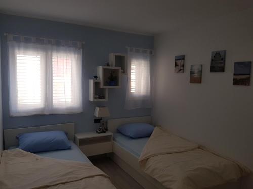 Ένα ή περισσότερα κρεβάτια σε δωμάτιο στο Sunset holiday Krk