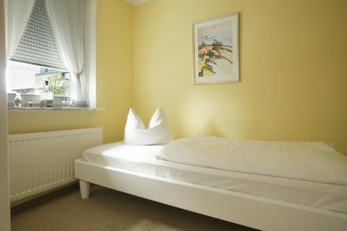 מיטה או מיטות בחדר ב-Das Sonnenblumenhaus