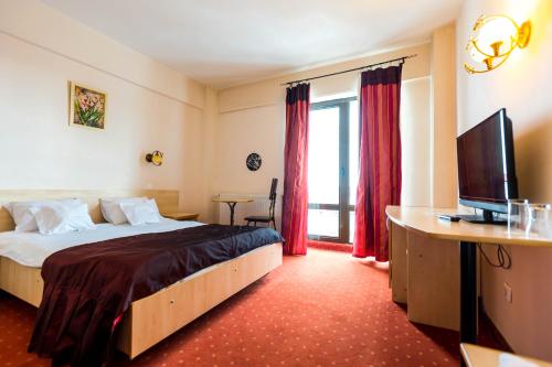 Voodi või voodid majutusasutuse Hotel Onix toas