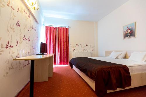 Postel nebo postele na pokoji v ubytování Hotel Onix